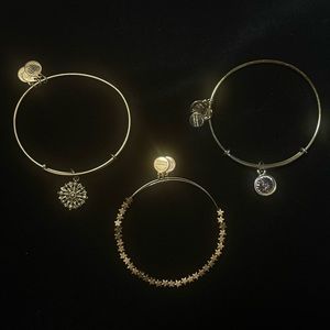 Alex and Ani bronze/gold bracelets with compass, star and pink birth stone charm